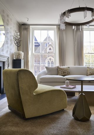 neutral living room with yellow armchair