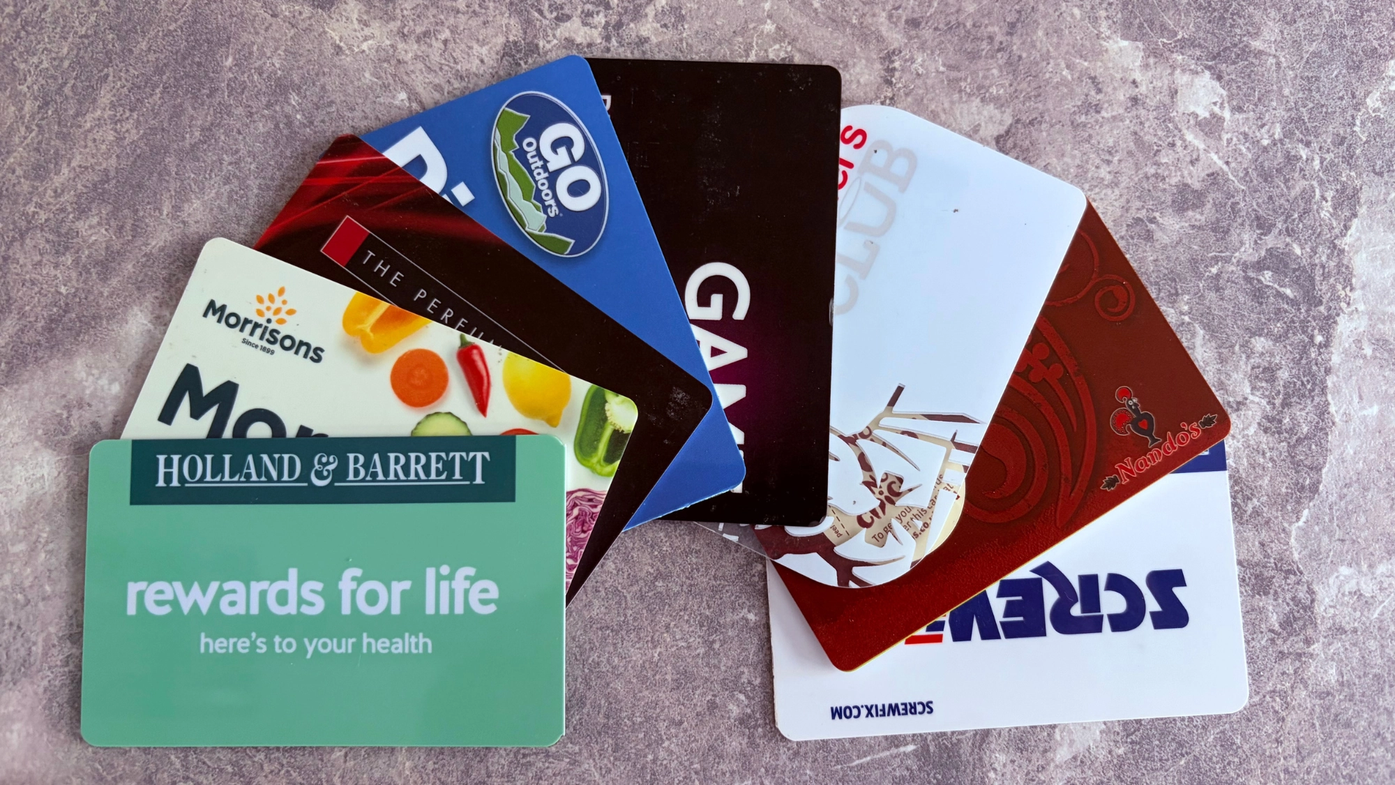 A photo of various rewards cards fanned out 