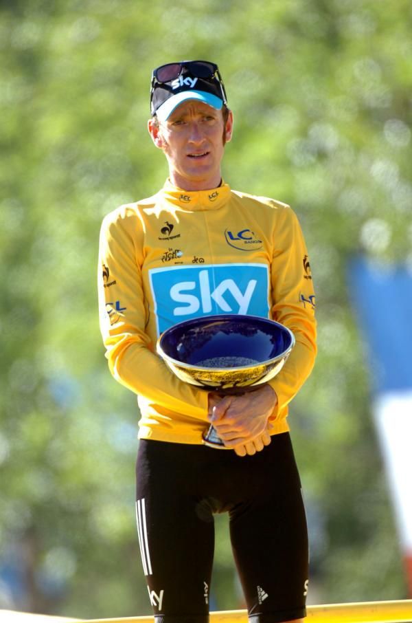 Wiggins stands on the Tour podium