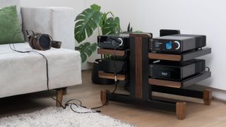 The Cyrus 40 Series devices on a hi-fi rack and connected to headphones.