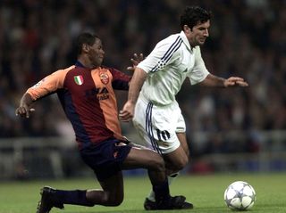 Roma's Aldair fights for the ball with Real Madrid's Luis Figo in a Champions League clash in October 2001.