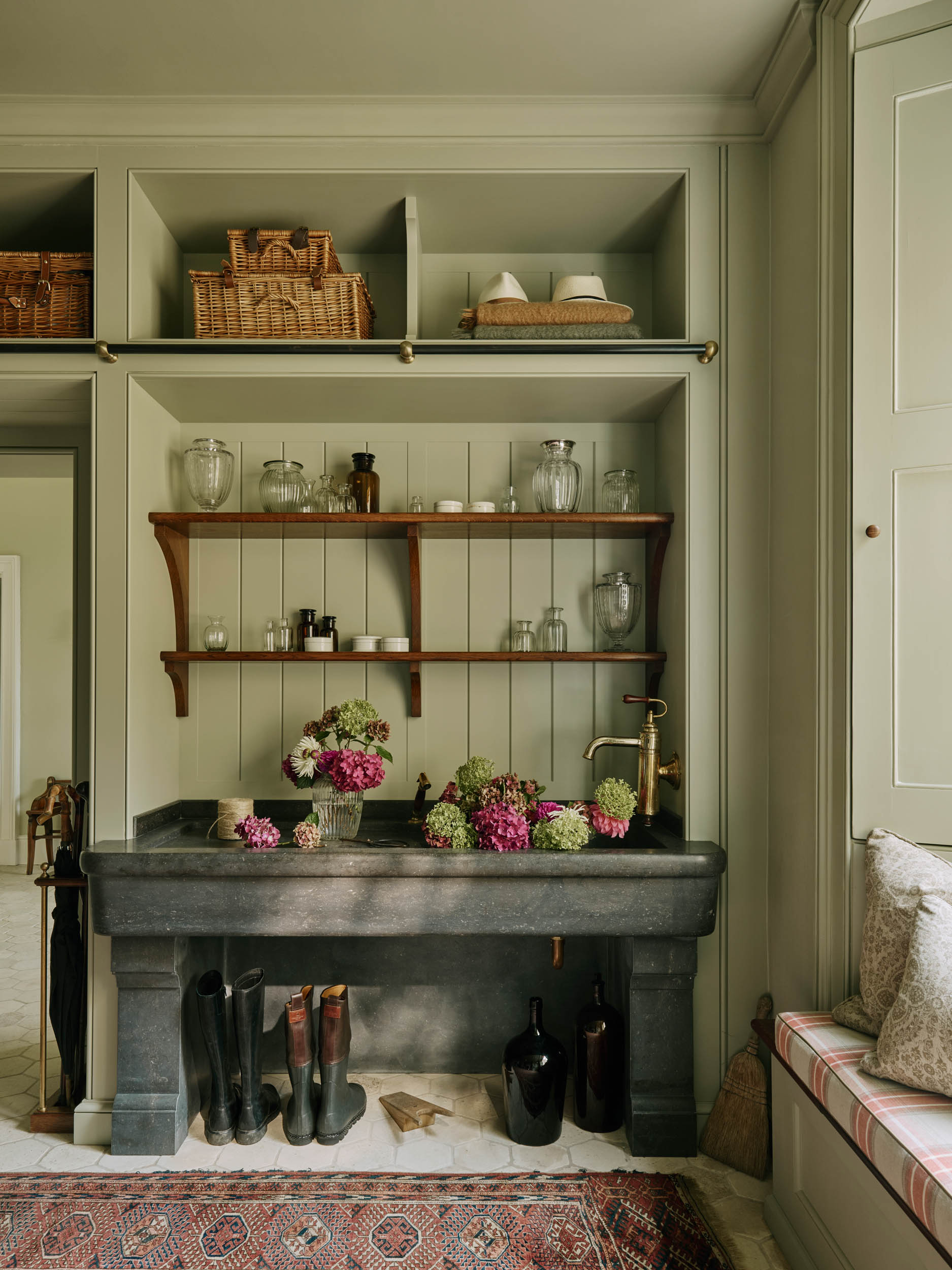 A sink carved from Belgian blue limestone in a Regency house boot room designed by the Somerset-based company Artichoke &amp;mdash; Country Life Top 100 2026