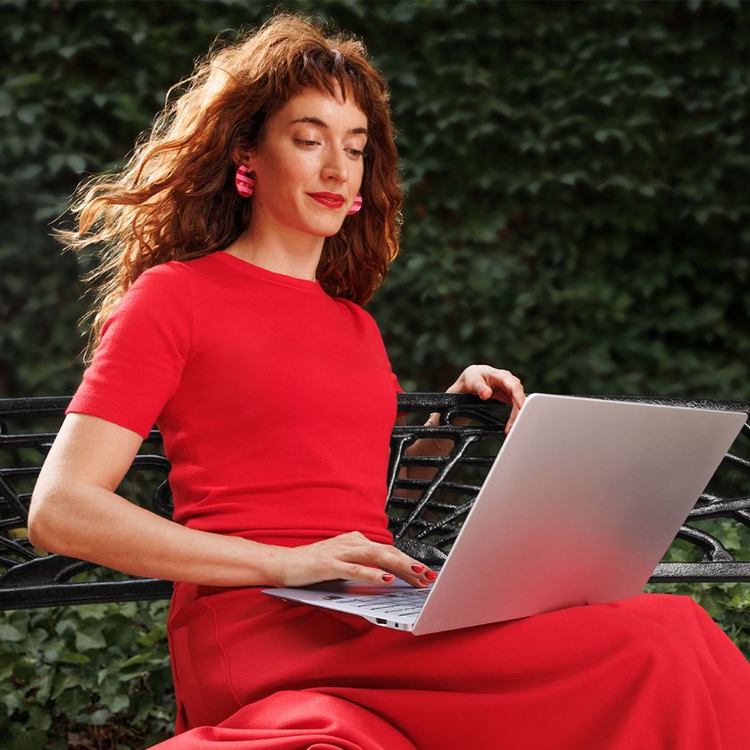 Woman using her Snapdragon laptop