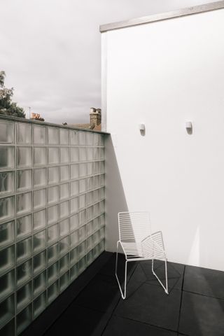 Remi Connoly-Taylor's new home features a terrace looking out towards the East London roofs cape