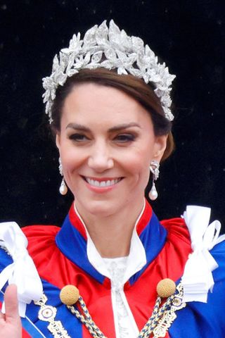 Kate Middleton headshot with a side bun and tiara hairstyle