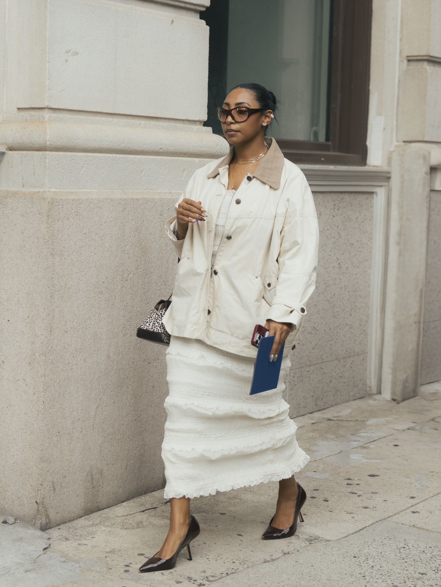 woman wearing cream jacket and cream skirt