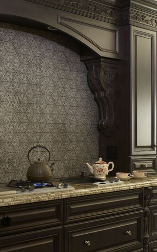 black kitchen with tiled splashback