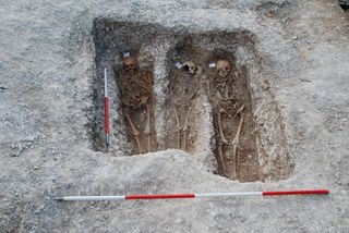 Excavation of the St. Mary Magdalen leprosarium in Winchester, UK, with in situ skeletons.