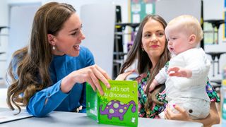 Catherine, Duchess of Cambridge meets Laura Molloy and her 10-month-old son during a visit to St. John's Primary School in Glasgow