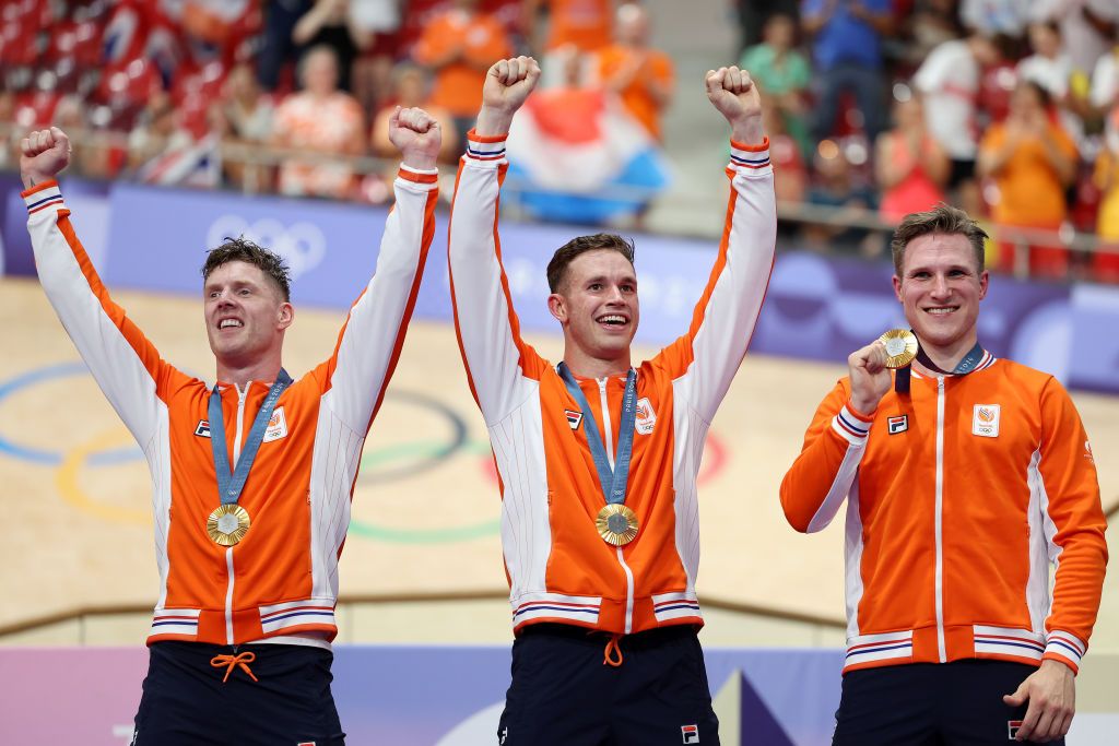 PARIS FRANCE AUGUST 06 Gold medalists Jeffrey Hoogland Harrie Lavreysen and Roy van den Berg of Team Netherlands pose on the podium after the Mens Team Sprint Finals on day eleven of the Olympic Games Paris 2024 at SaintQuentinenYvelines Velodrome on August 06 2024 in Paris France Photo by Tim de WaeleGetty Images