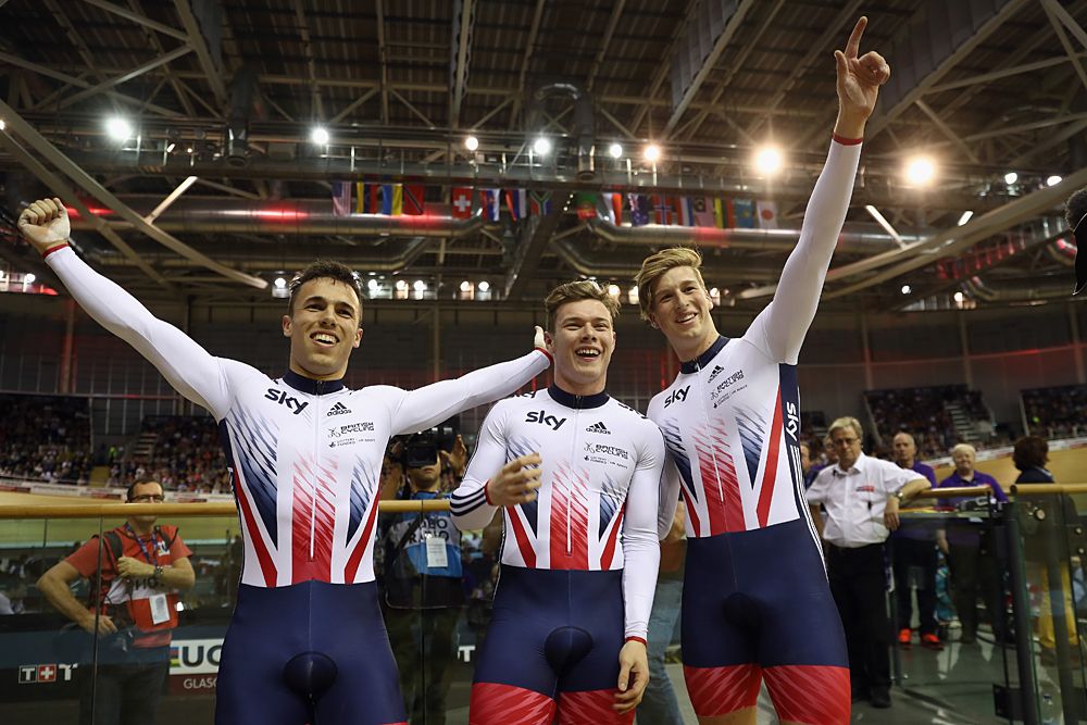 Britain's Jack Carlin (C), Ryan Owens (L) and Joe Truman celebrate after winning the men's team sprint final