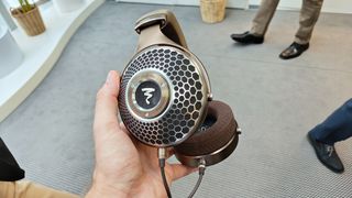 Focal Clear Mg held in the hand