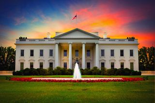 The White House pictured in front of a sunset