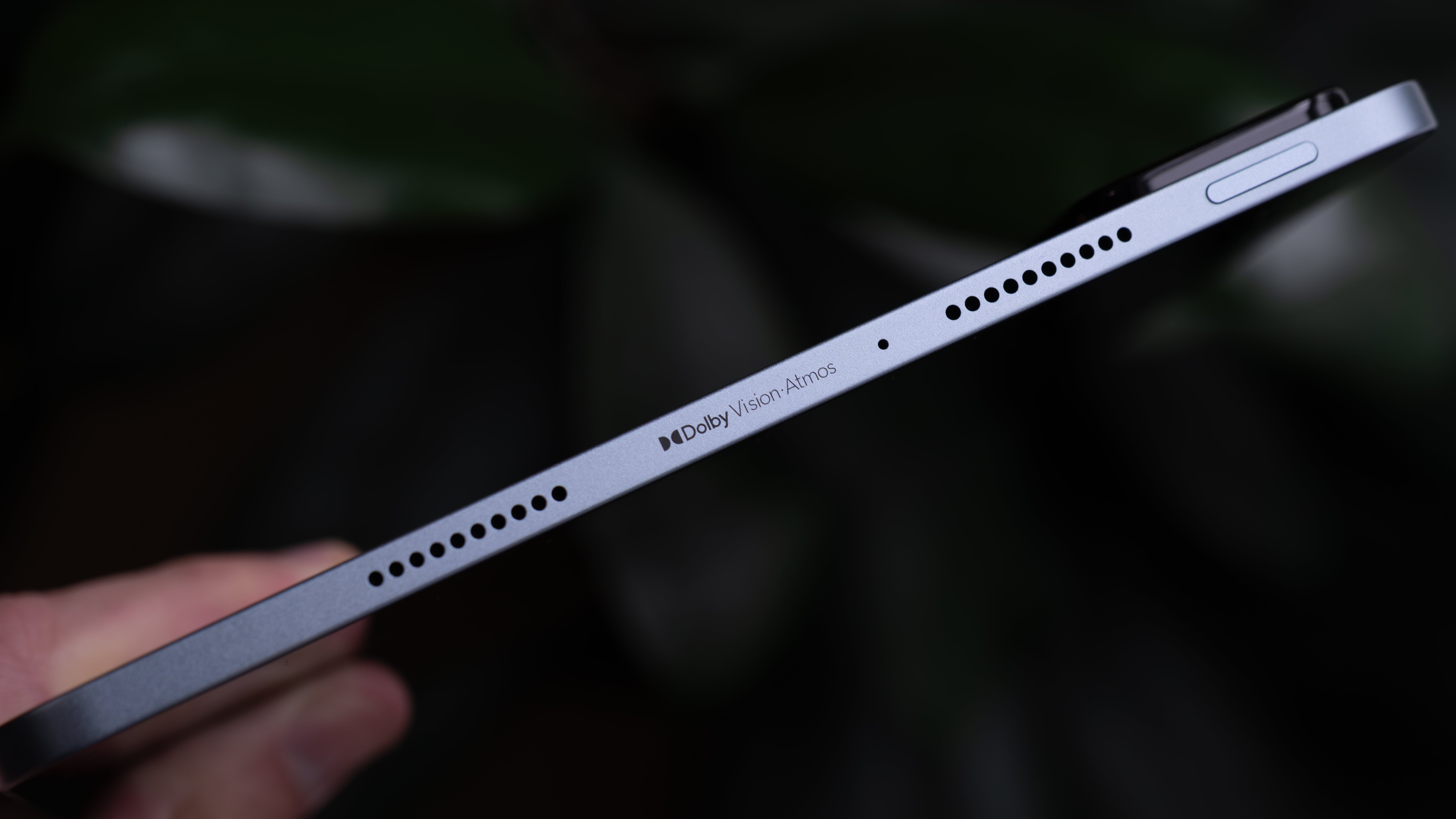 Side profile of the Xiaomi Pad 8 Pro highlighting the slim metal frame, speaker grille and Dolby Vision Atmos branding.