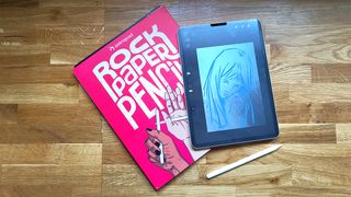 Rock Paper Pencil review; an iPad and iPad protective cover on a wooden table