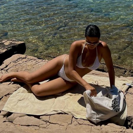 @lucywilliams02 wearing a patterned cover-up