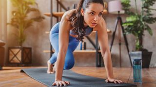 Five Ideas for Fun Cardio HIIT Workouts: woman exercising on yoga mat