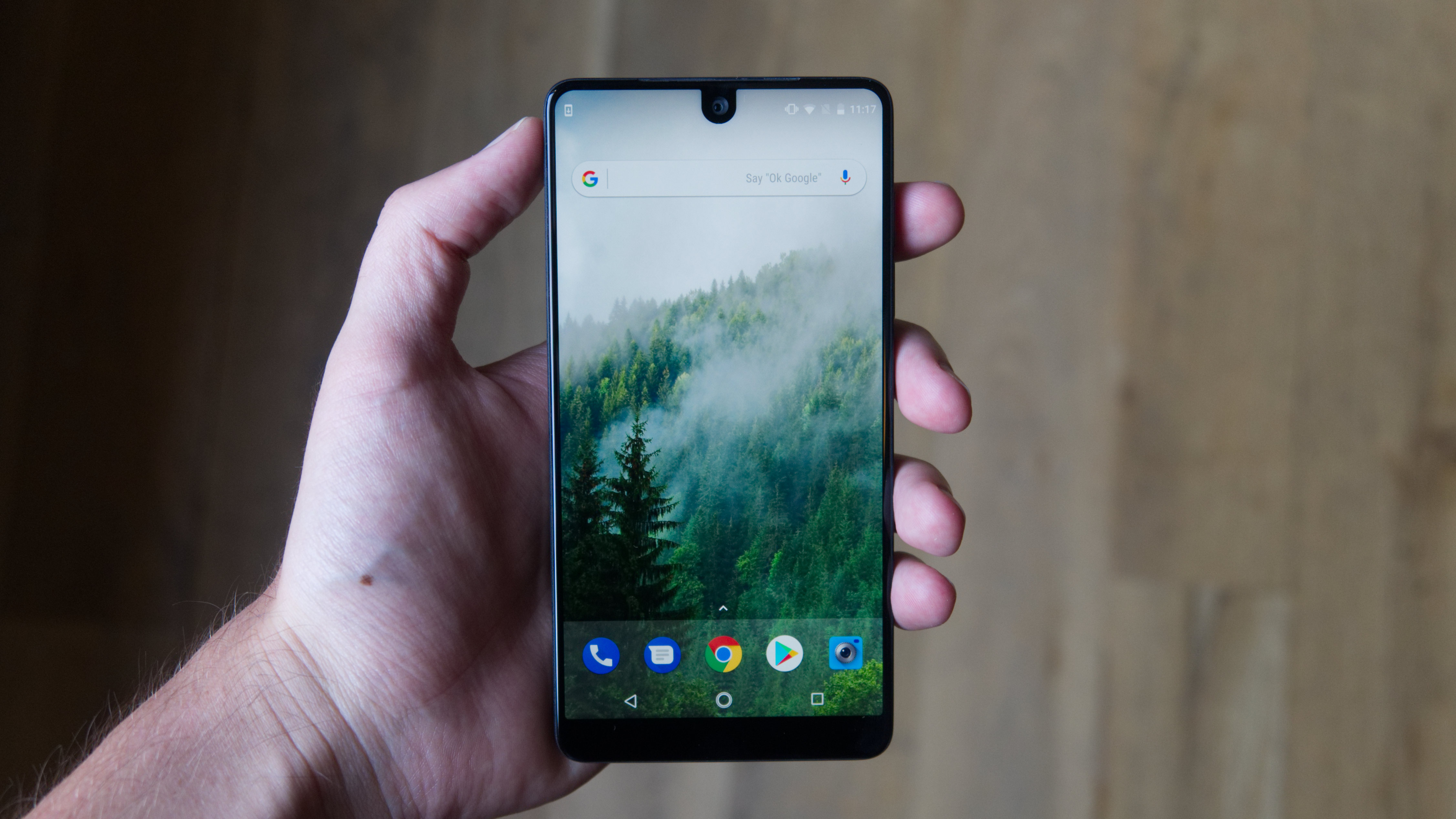Essential Phone held in a hand.