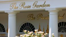 Gold letters at the White House spell out 'The Rose Garden'