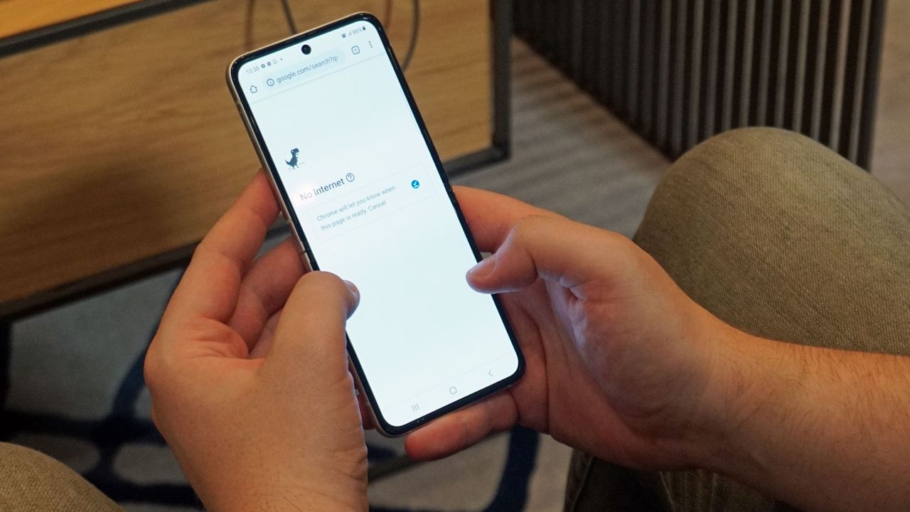 A Samsung Galaxy Z Flip 3 in someone's hand, with the screen on