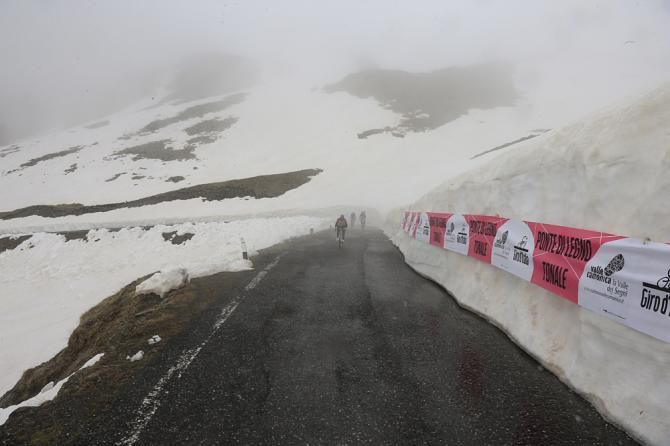 Snow lines the roads over the Gavia