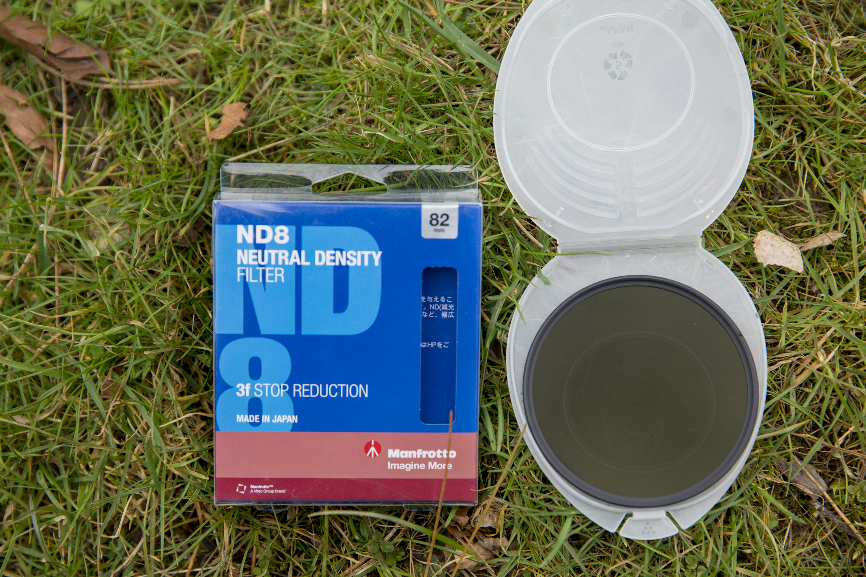 Photo of ND filters and a case on green grass