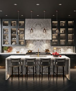 Designing a modern kitchen, illustrated in a dark gray scheme with uplit marble kitchen island and marble countertops and wall.