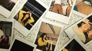 Polaroid pictures scattered across a table