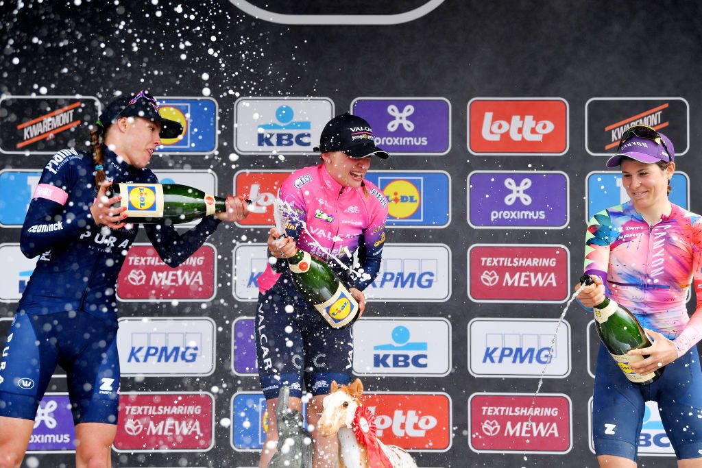 WAREGEM BELGIUM MARCH 30 LR Julie De Wilde of Belgium and PlanturPura Team on second place race winner Chiara Consonni of Italy and Valcar Travel Service Team and Elise Chabbey of Switzerland and Canyon SRAM Racing Team on third place celebrate on the podium during the podium ceremony after rquethe 10th Dwars door Vlaanderen 2022 Womens Elite a 120km one day race from Waregem to Waregem DDV22 DDVwomen on March 30 2022 in Waregem Belgium Photo by Luc ClaessenGetty Images