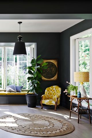 Dark grey living room with yellow armchair