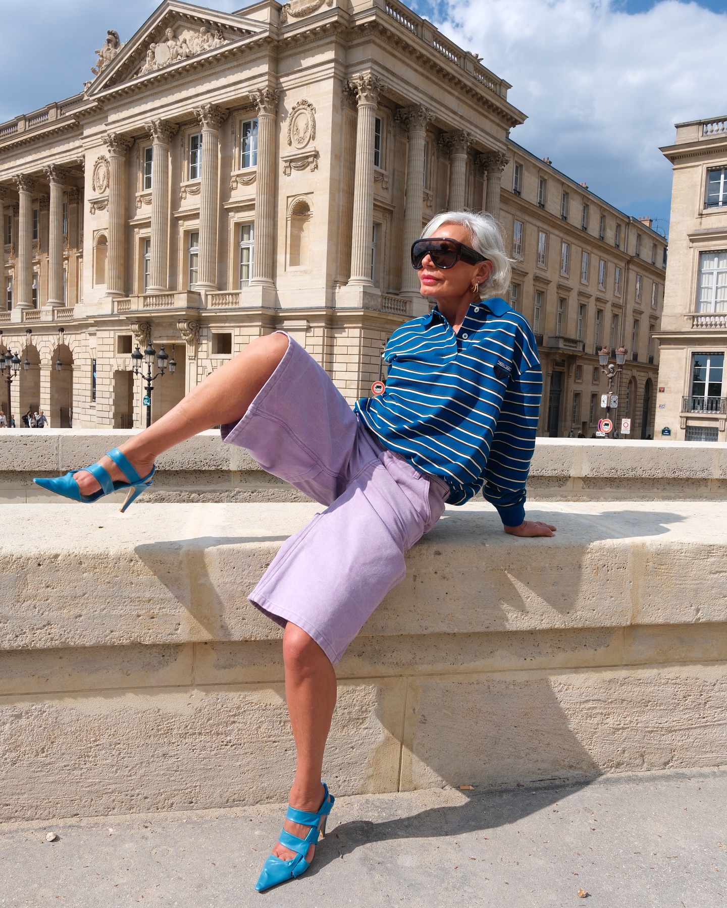 High heels wearing long shorts: @greceghanem wearing blue high heels and purple shorts