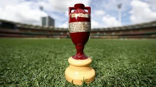 Close up of Ashes urn trophy on a cricket pitch