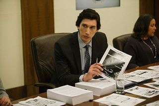 Adam Driver as Daniel J. Jones looking through paperwork in The Report.