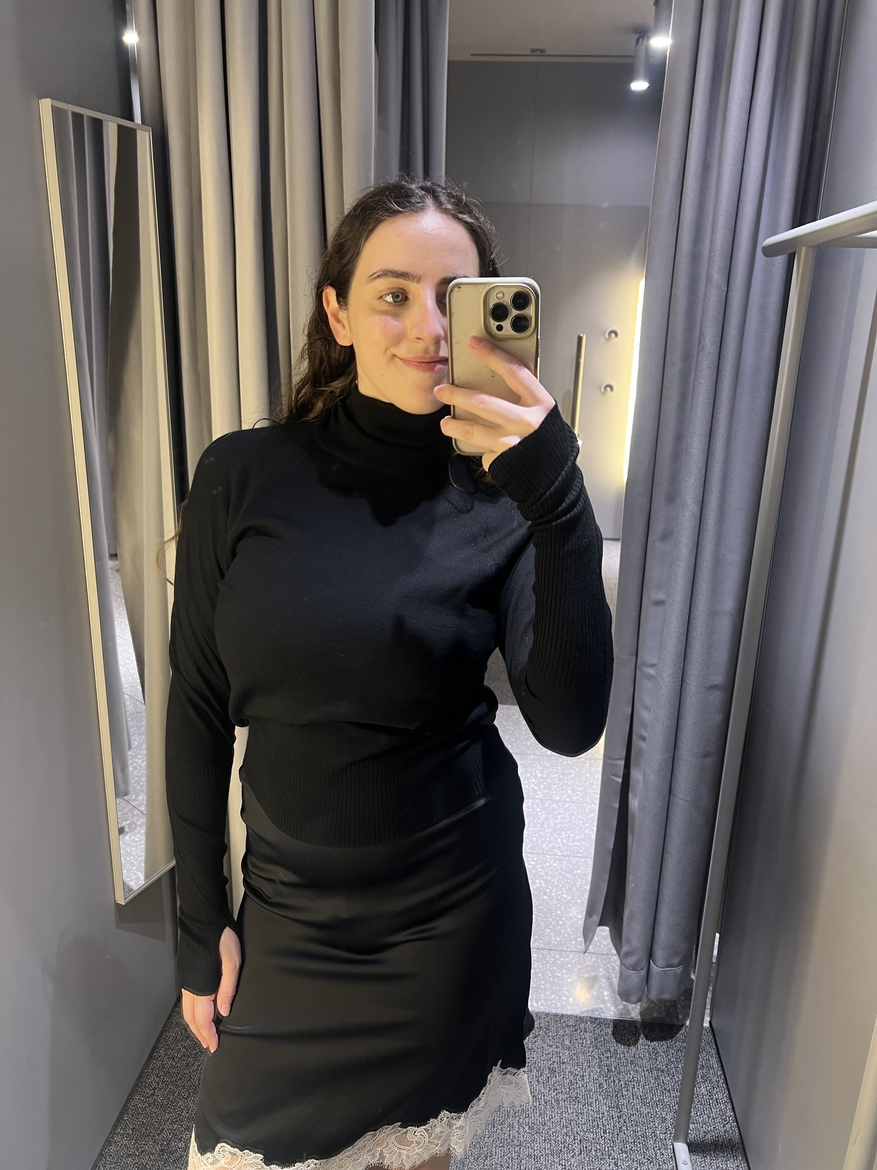 An image of Who What Wear&#039;s Ava Gilchrist wearing one of the best turtlenecks from Arket.