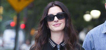 Anne Hathaway wearing dark sunglasses