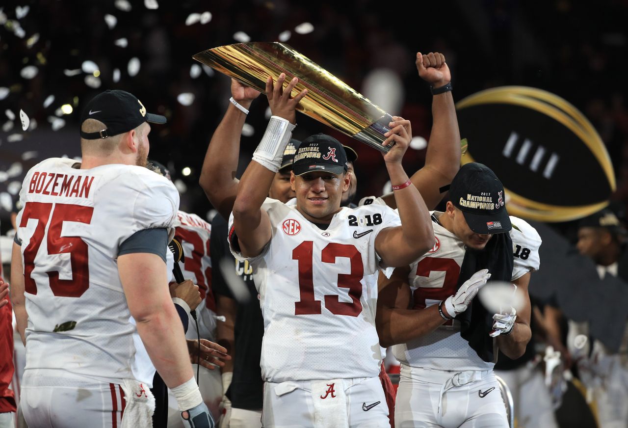 Alabama Crimson Tide team members celebrate their win