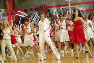 the we're all in this together scene from High School Musical of the cast dancing on the basketball court