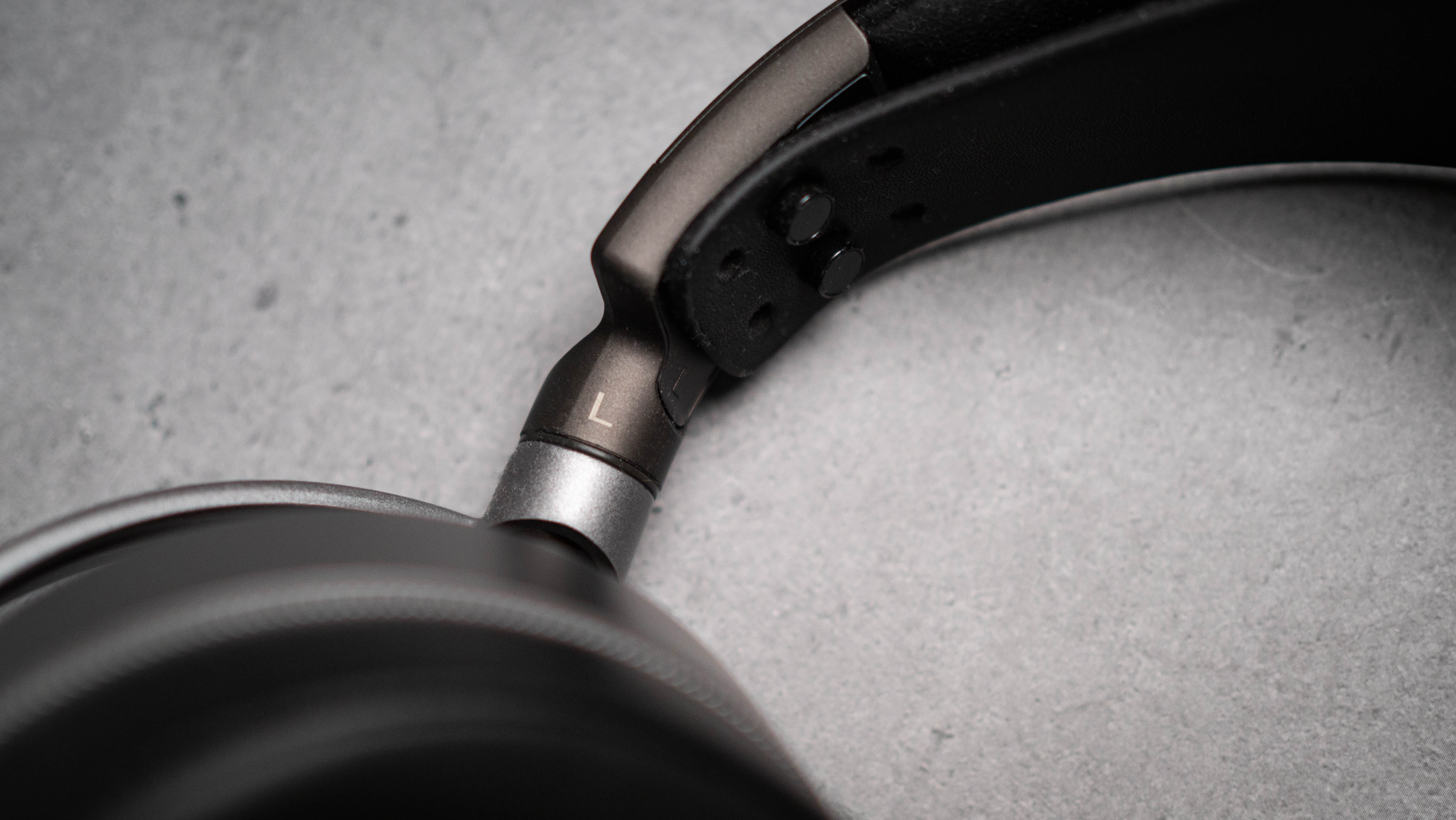 Audeze LCD-S20 planar headset in front of gray kraft sheet highlighting product design
