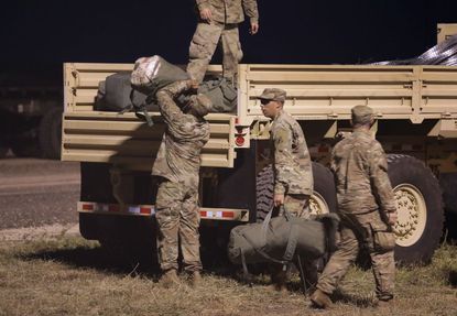 U.S. Army soldiers move to another location near the U.S.-Mexico border on November 3, 2018 in Donna, Texas. 