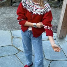 Influencer @lucywilliams02 wears a fairisle cardigan and jeans and red loafers.