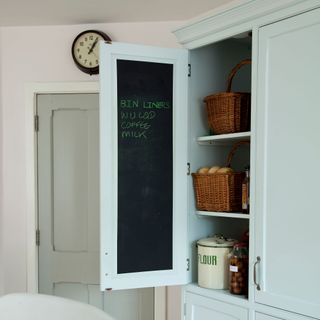 kitchen pantry with white cupboard
