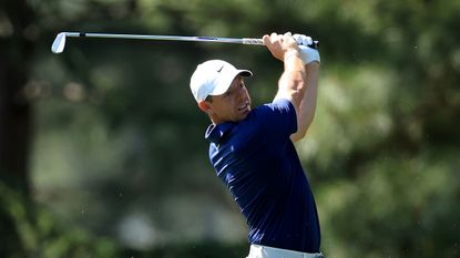 Rory McIlroy hits an iron shot during The Masters in 2024