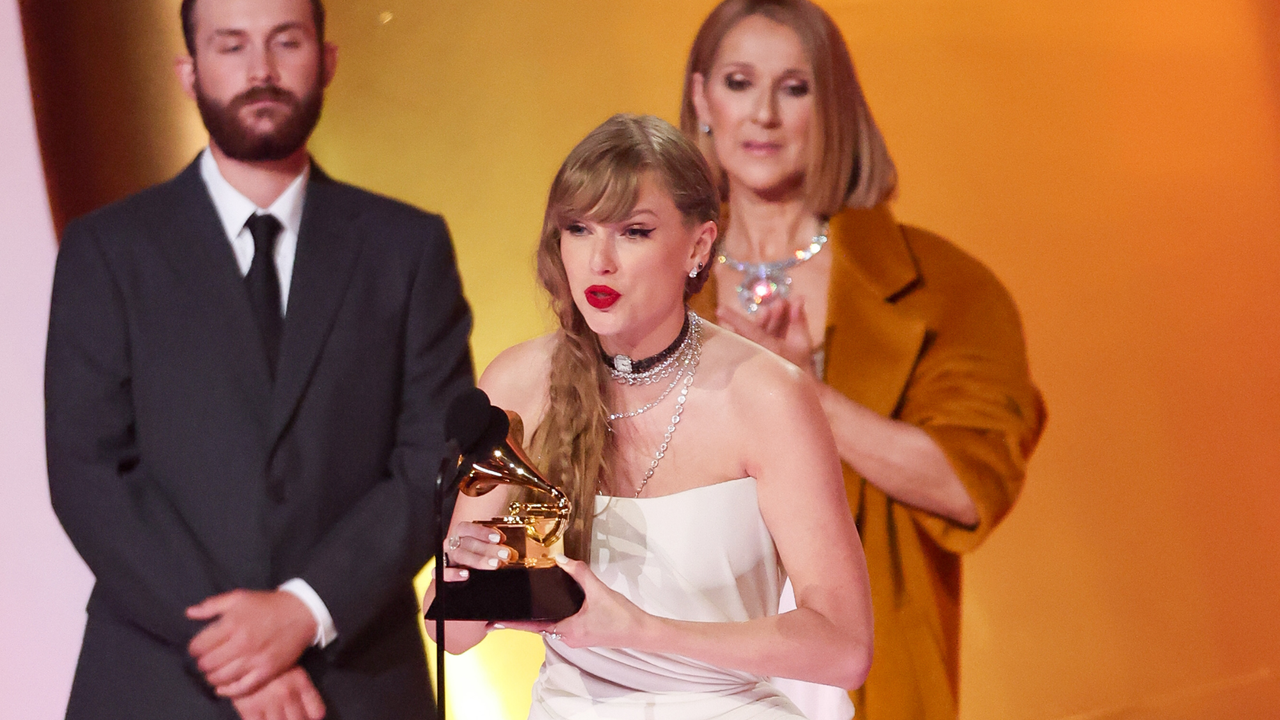 Taylor Swift accepts the Album Of The Year award for &quot;Midnights&quot; on stage with Celine Dion at the 66th Annual GRAMMY Awards held at Crypto.com Arena on February 4, 2024 in Los Angeles, California