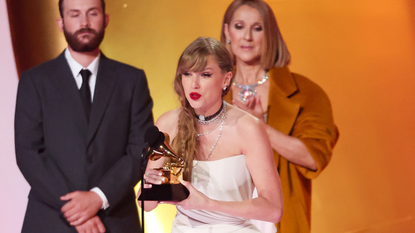 Taylor Swift accepts the Album Of The Year award for "Midnights" on stage with Celine Dion at the 66th Annual GRAMMY Awards held at Crypto.com Arena on February 4, 2024 in Los Angeles, California