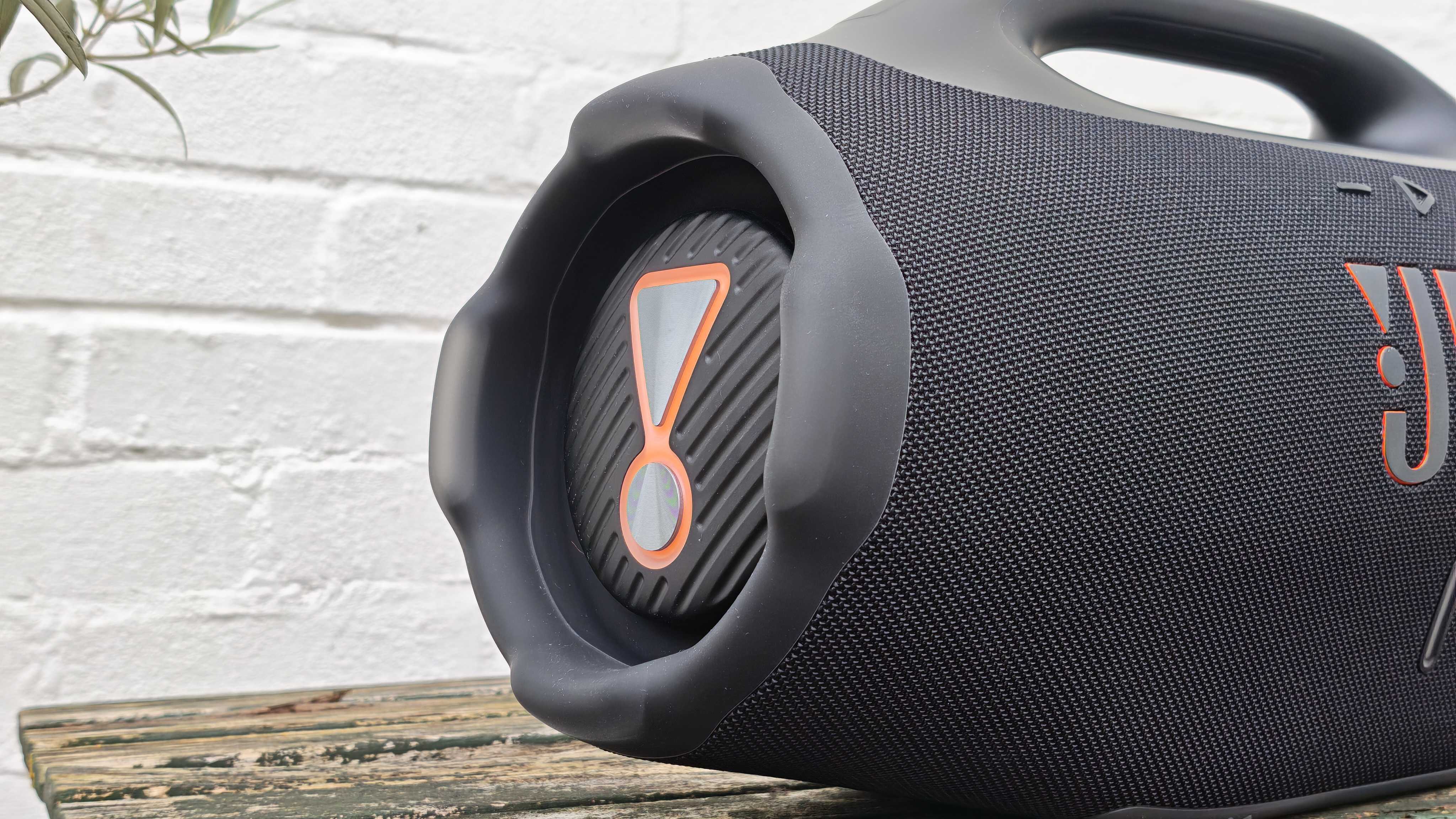 The JBL Boombox 4 on a table outside.