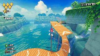 Rascal leaps towards wooden platforms in Buccaneer's Beach in Rollin' Rascal