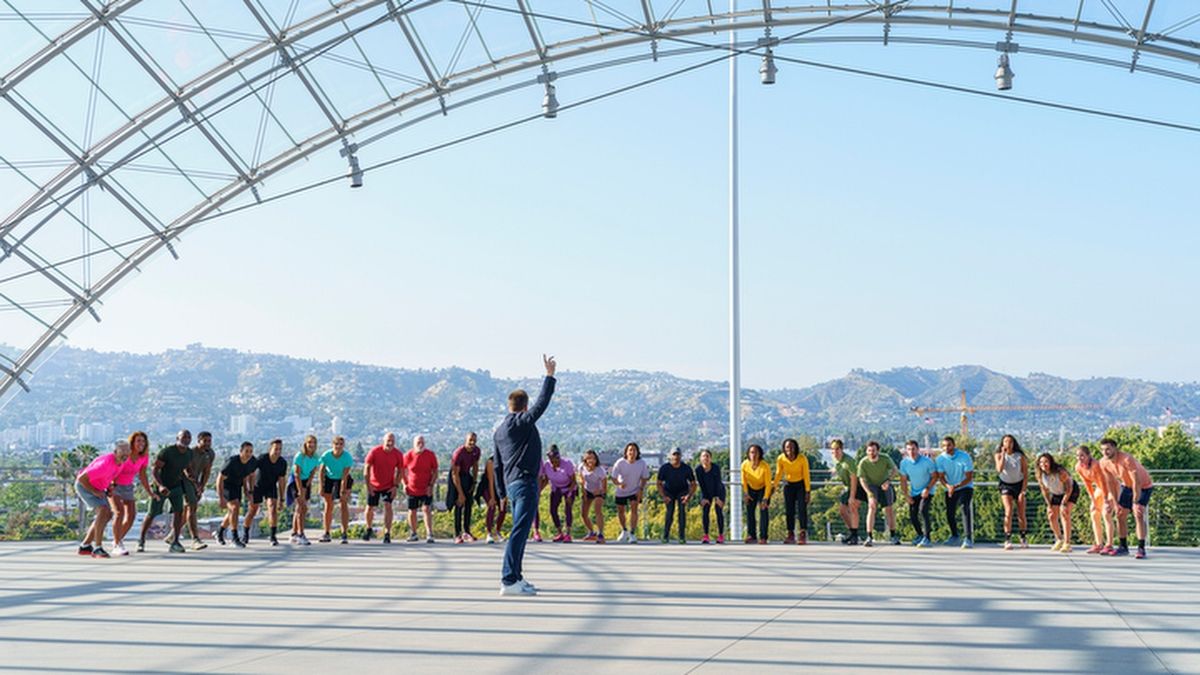 The 2025 contestants wait on the start line as host Phil Keoghan prepares to start &quot;The Amazing Race&quot; season 37