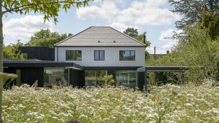 The rear exterior of a contemporary extension to a 1930s detached home
