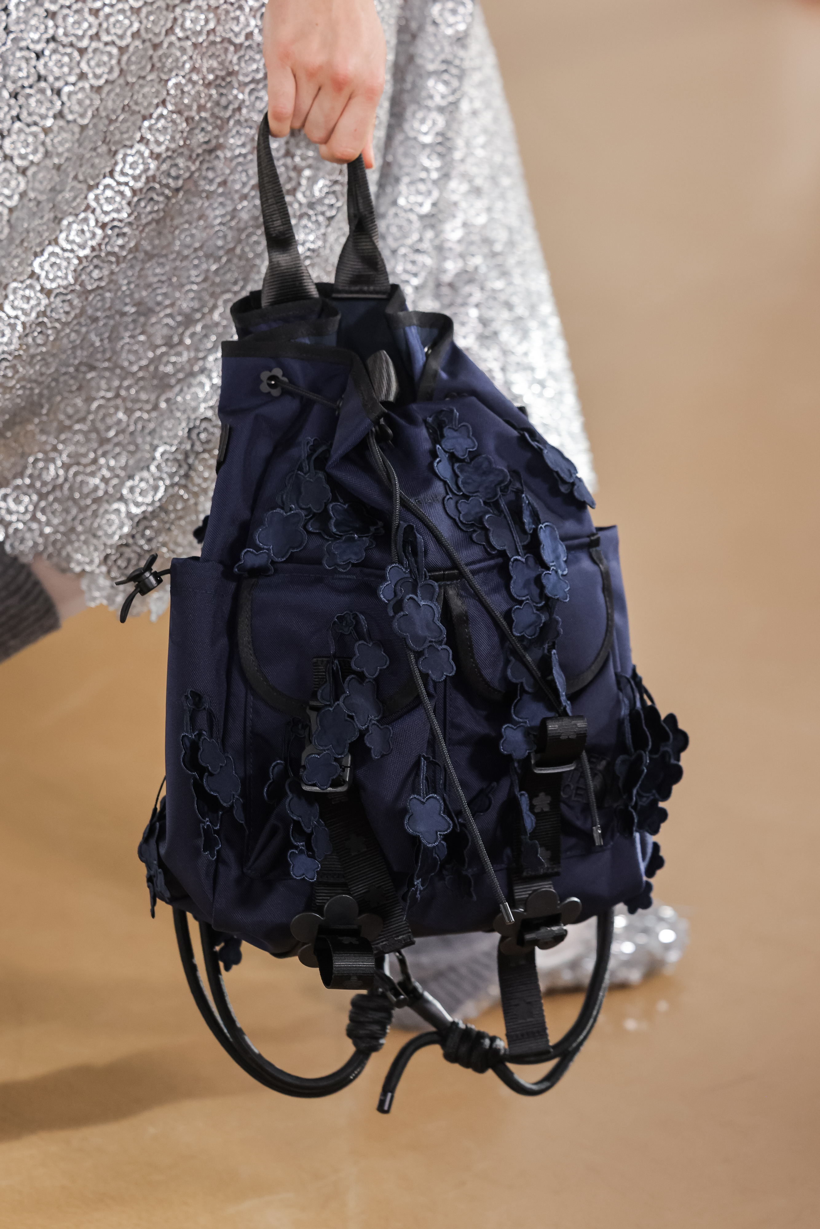 a close up of a cecilie bahnsen north face floral bag
