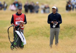 Tiger Woods chats to his caddie during The Open